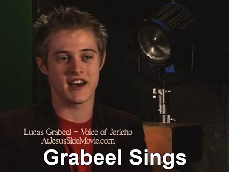 Screenshot of video showing Lucas Grabeel singing.