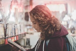 Woman browsing for movie DVDs